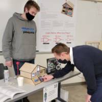 2 people around a senior project